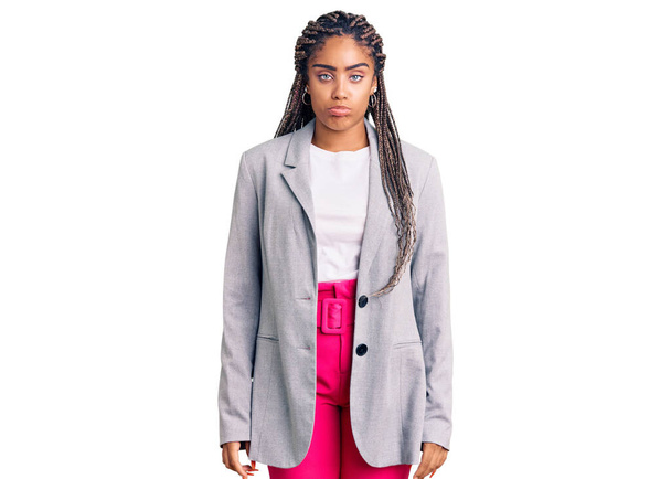 Young african american woman with braids wearing business clothes depressed and worry for distress, crying angry and afraid. sad expression.  - Photo, Image