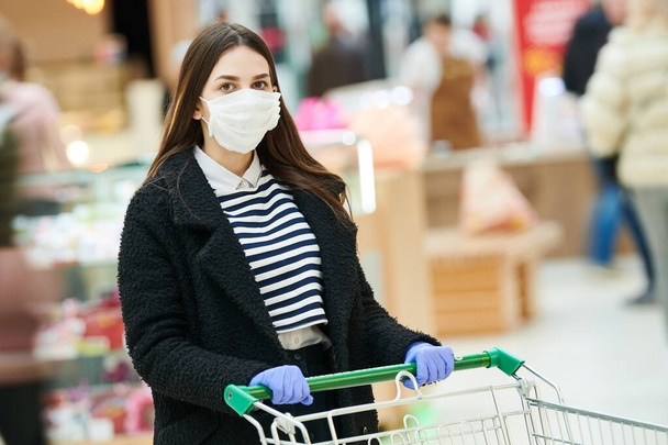 woman with face mask at public place. coronavirus outbreak - 写真・画像