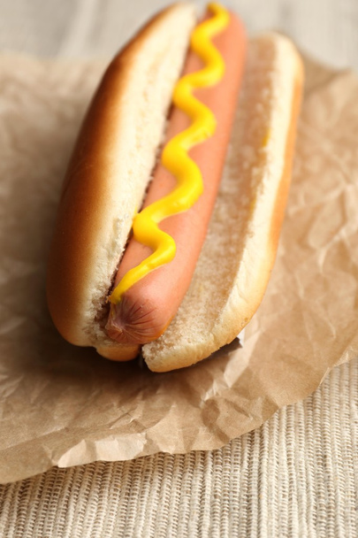 Tasty hot dog on paper - Foto, Imagen
