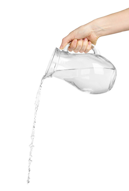 Pouring water from glass pitcher, isolated on white - Фото, зображення
