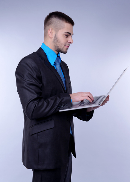 Business man on grey background - Foto, Imagem