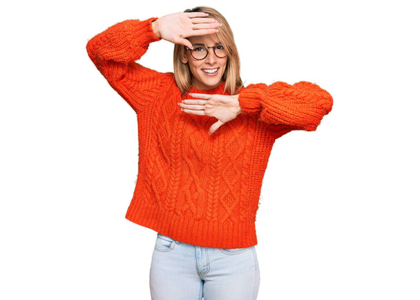 Beautiful blonde woman wearing casual clothes and glasses smiling cheerful playing peek a boo with hands showing face. surprised and exited  - Φωτογραφία, εικόνα