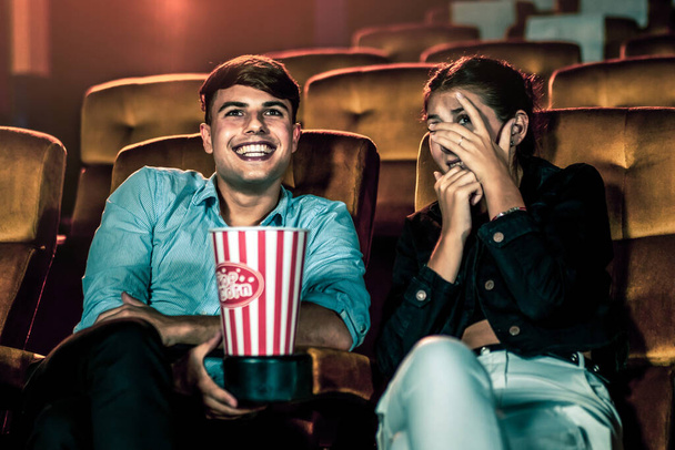 A couple of caucasian watch a movie in the cinema - 写真・画像
