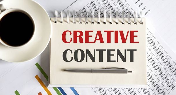 CREATIVE CONTENT text written on notebook with pen and chart - Photo, Image