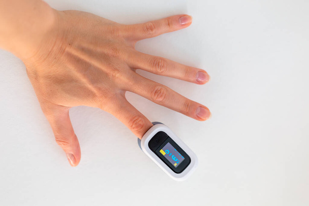 pulse oximeter on a finger - Fotó, kép