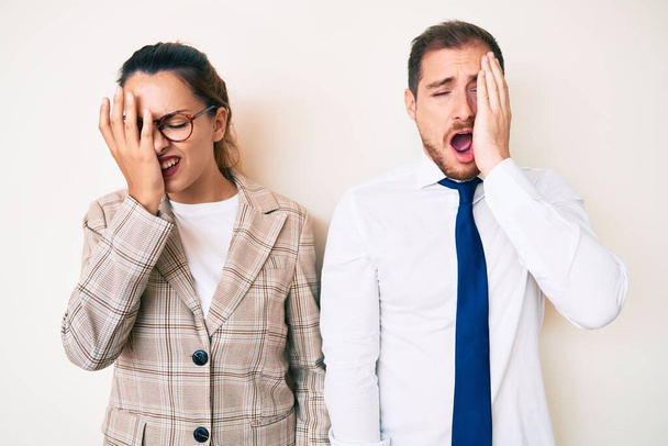 Beautiful couple wearing business clothes yawning tired covering half face, eye and mouth with hand. face hurts in pain.  - Φωτογραφία, εικόνα
