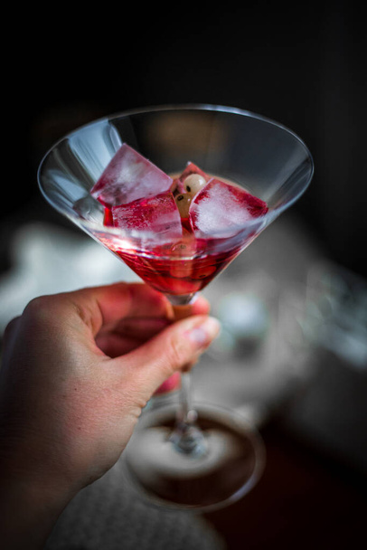 red martini glass with cherry - Foto, afbeelding
