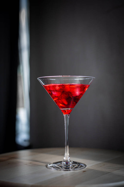 red martini glass with cherry - Fotó, kép