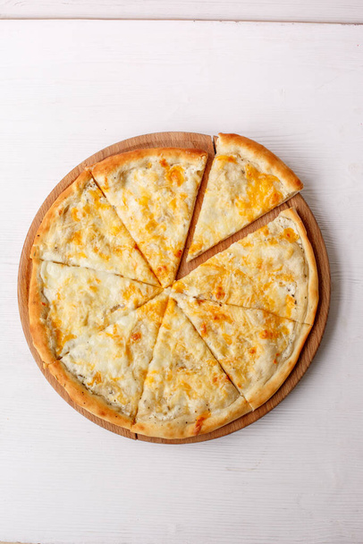 tasty cheese pizza on wooden board - Photo, Image