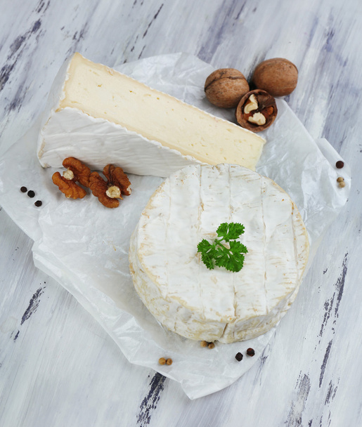 Tasty Italian cheese on wooden table - Valokuva, kuva