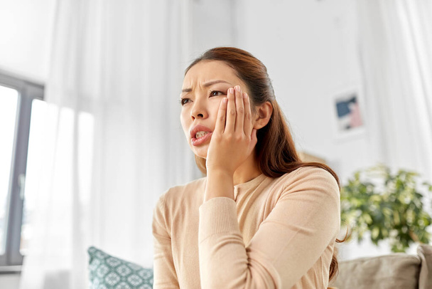 asian woman suffering from toothache at home - Valokuva, kuva