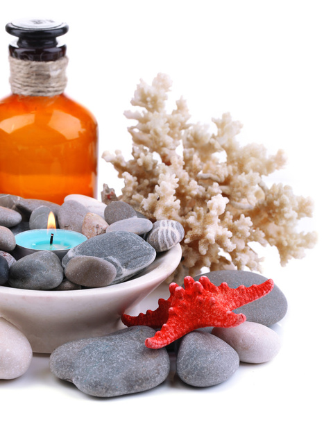 Composition with spa stones, candle, coral and star fish, isolated on white - Foto, afbeelding