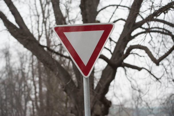 a give way or yield traffic sign on the street - Photo, Image