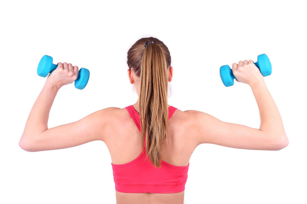 Young beautiful fitness girl exercising with dumbbells, close-up, isolated on white - Φωτογραφία, εικόνα