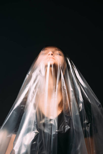 plastic pollution woman polyethylene bag black - Valokuva, kuva