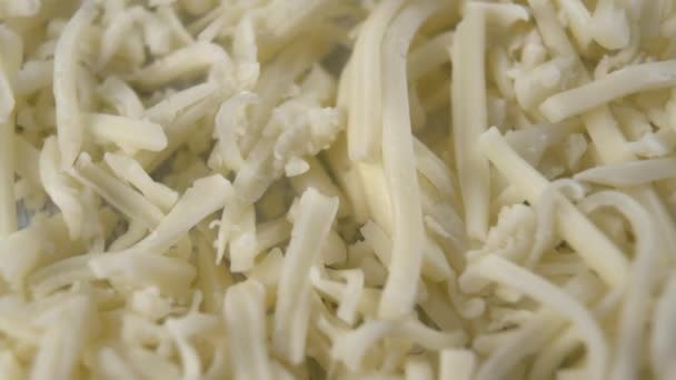 Fresh grated cheese close-up. Macro shot. Rotation - Video, Çekim
