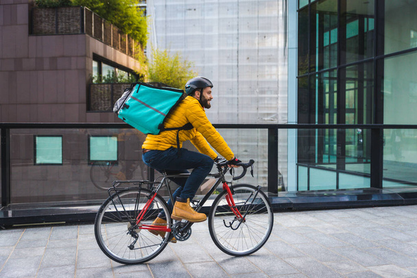 Food delivery service, rider delivering food to clints with bicycle - Concepts about transportation, food delivery and technology - Foto, Imagen