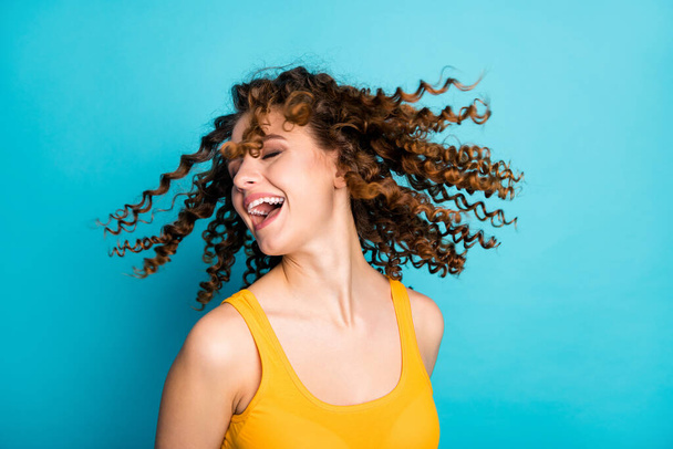 Close up photo of funky lady good mood wavy hairdo flight laughing isolated blue color background - Foto, imagen
