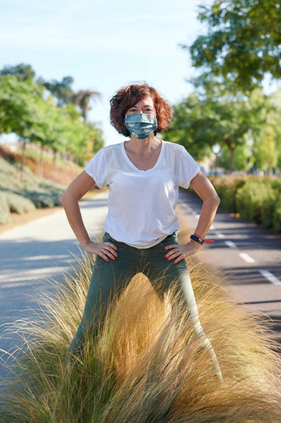 happy woman with medical mask, positive concept in front of the new reality - Foto, imagen