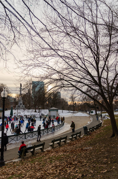 People ice-skating during a snow winter in Boston Common - Photo, Image