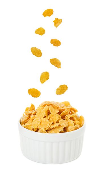 Bowl with corn flakes on the white background - Photo, Image
