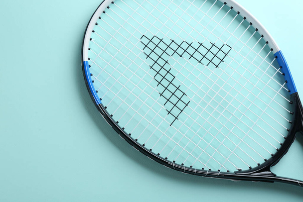 Tennis racket on light blue background, top view. Sports equipment - Fotoğraf, Görsel