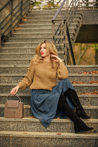 best place to rest. female beauty. Fashion model. girl long blond hair stairs. casual style student. fall season. girl in corrugated skirt and sweater. Pleated trend. autumn woman curly hair outdoor - Fotoğraf, Görsel