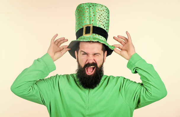 Myth of leprechaun. Happy patricks day. Man bearded hipster wear green clothing and hat patricks day. Global celebration of irish culture. Saint patricks day holiday. Green color part of celebration - Foto, Bild
