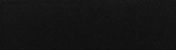 Υψηλή ορθογώνια μαύρη επιφάνεια γυαλόχαρτου, χαρτί λείανσης φόντου - Φωτογραφία, εικόνα