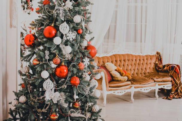 New Year's interior. Christmas tree. Christmas decorations. Luxury. New Year's toys Christmas tree gifts. Photo with tinted. New Year - Zdjęcie, obraz