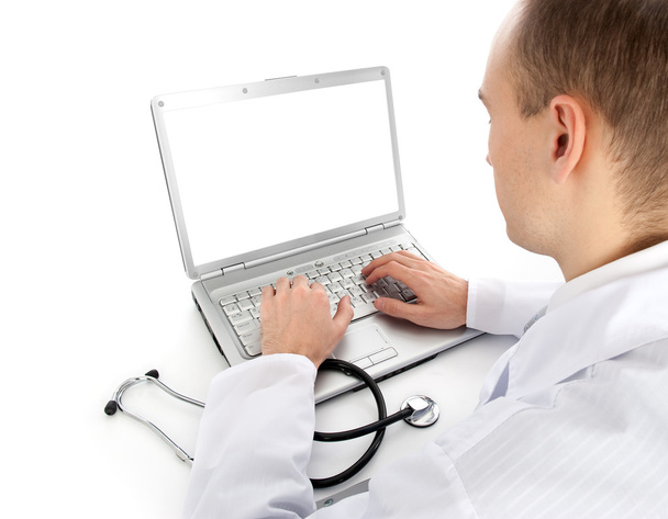 widok z tyłu młody lekarz z laptopa - Zdjęcie, obraz