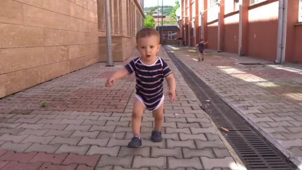 Happy baby playing outside on a Sunny day.... - Footage, Video