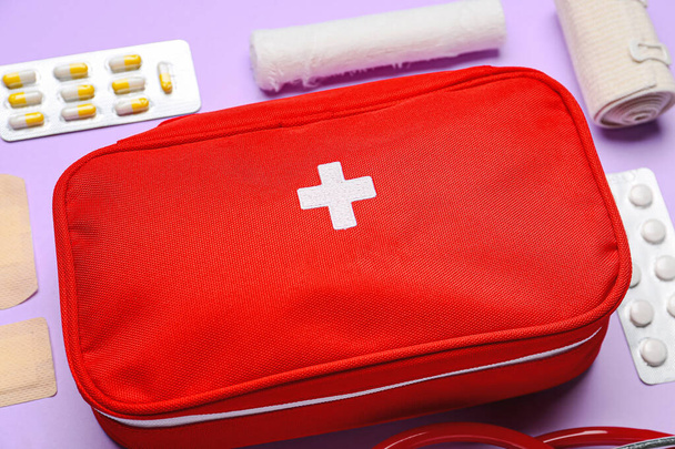 First aid kit on color background - Fotó, kép