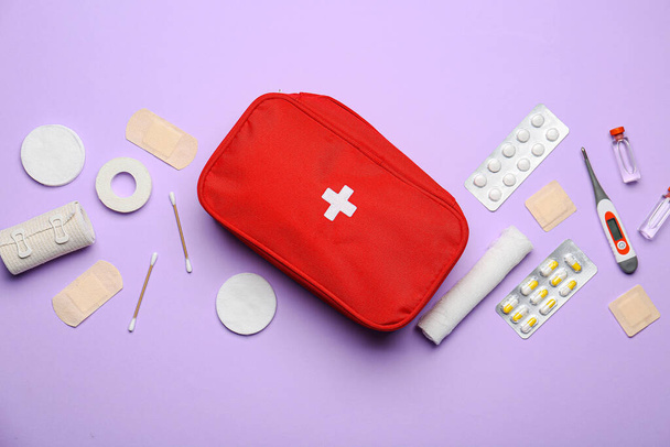 First aid kit on color background - Фото, зображення