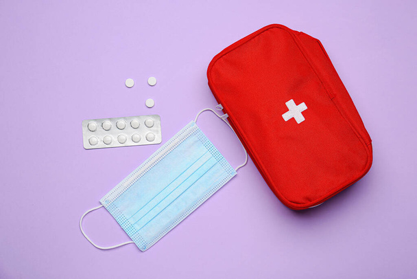 First aid kit on color background - Valokuva, kuva