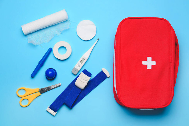 First aid kit on color background - Φωτογραφία, εικόνα