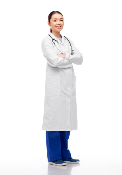 happy smiling asian female doctor in white coat - Fotó, kép