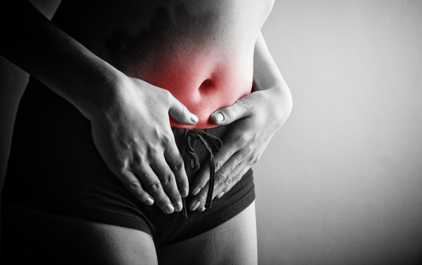 Woman suffering from abdominal pain - Valokuva, kuva