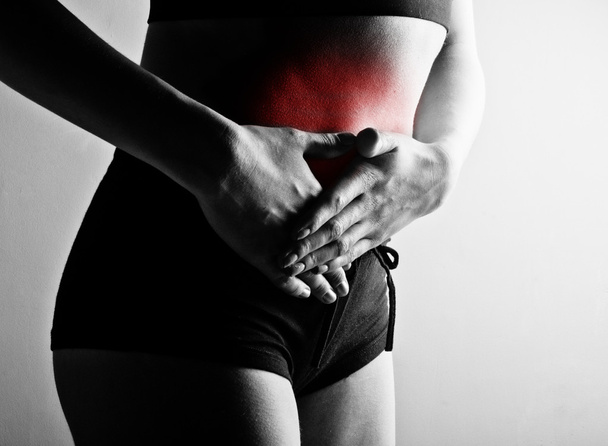 Woman suffering from abdominal pain - Zdjęcie, obraz