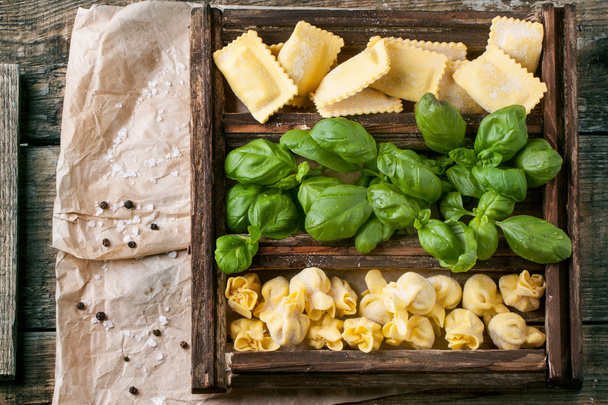 Box of pasta ravioli and basil - 写真・画像