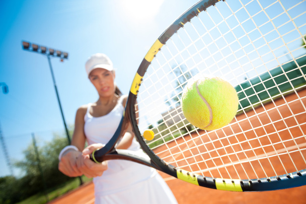 tennis player hitting the ball - Φωτογραφία, εικόνα