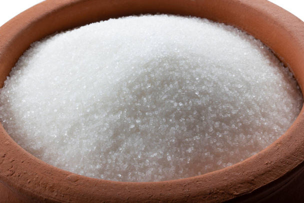 Granulated sugar in bowl. Crystals of refined table sugar. Sweet soluble carbohydrates. Sucrose, disaccharide of glucose and fructose. - Photo, Image