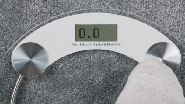 Inscription OMG on bathroom scales digital display - Footage, Video