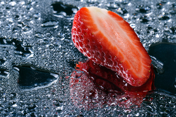 half of fresh strawberries with water drops horizontal - Photo, Image