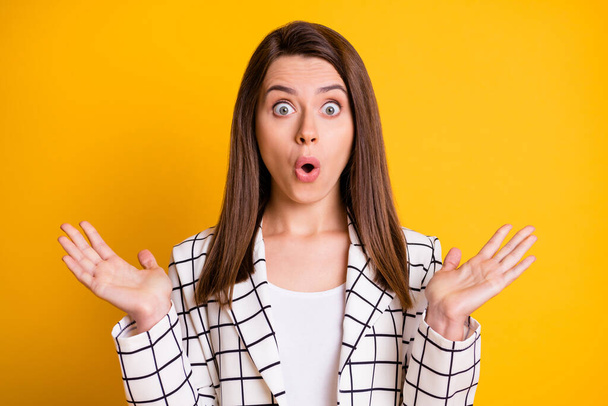 Photo of surprised amazed lady woman dressed white checkered blazer arms up lips pouted isolated yellow color background - Foto, Bild