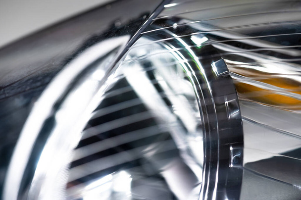 Macro close-up element of reflector of new car headlight headlight. Car background with soft focus - Valokuva, kuva