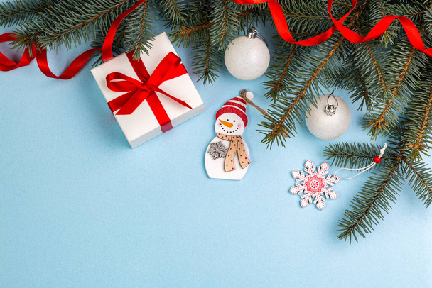 Christmas decorations lying on a blue background. Copy space. - Zdjęcie, obraz