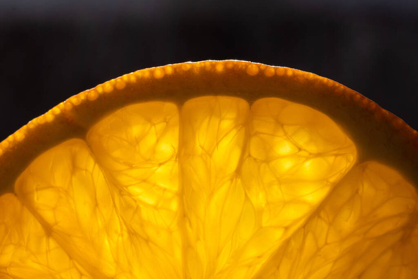 Fresh, juicy slices of orange under the sun, close-up. - Valokuva, kuva
