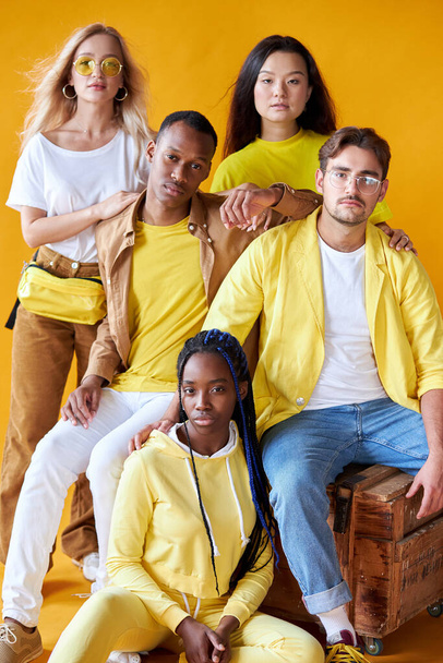 group of multiethnic friends, people of different cultures isolated on yellow background - Φωτογραφία, εικόνα