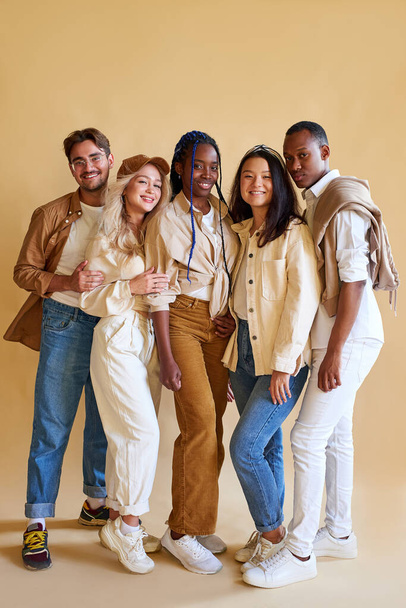 cheerful positive group of young people of diverse nationalities posing at camera - Photo, Image